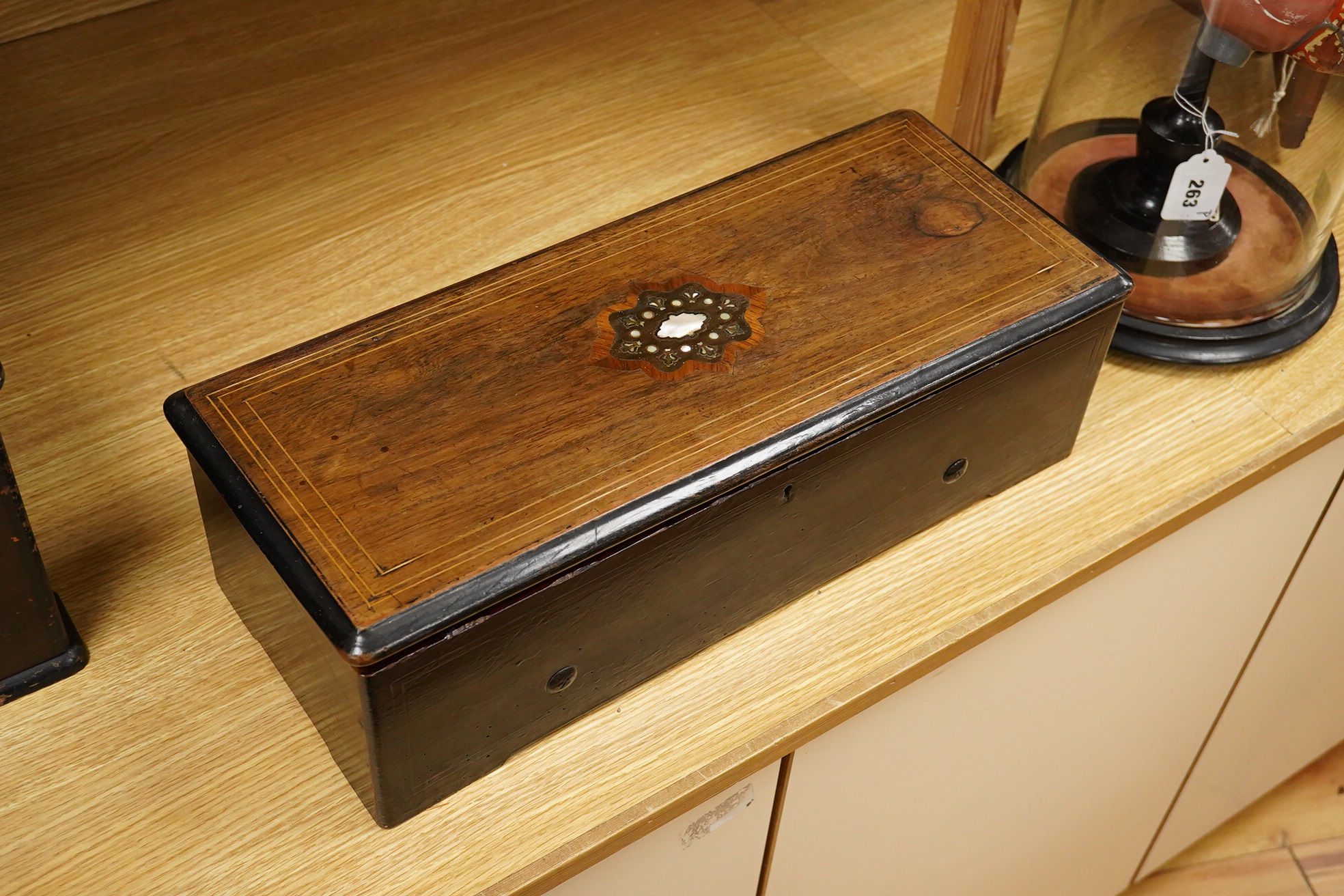 A late 19th century inlaid and ebonised rosewood Swiss cylinder music box by Nicole Freres, Geneve, and retailed by Alfred Hays, 4, Royal Exchange Buildings, complete with all teeth to the comb, cylinder 27.8cm long, the